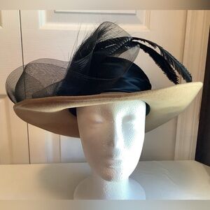 Michael Howard beige & black hat with black mesh & feather accent detailing.